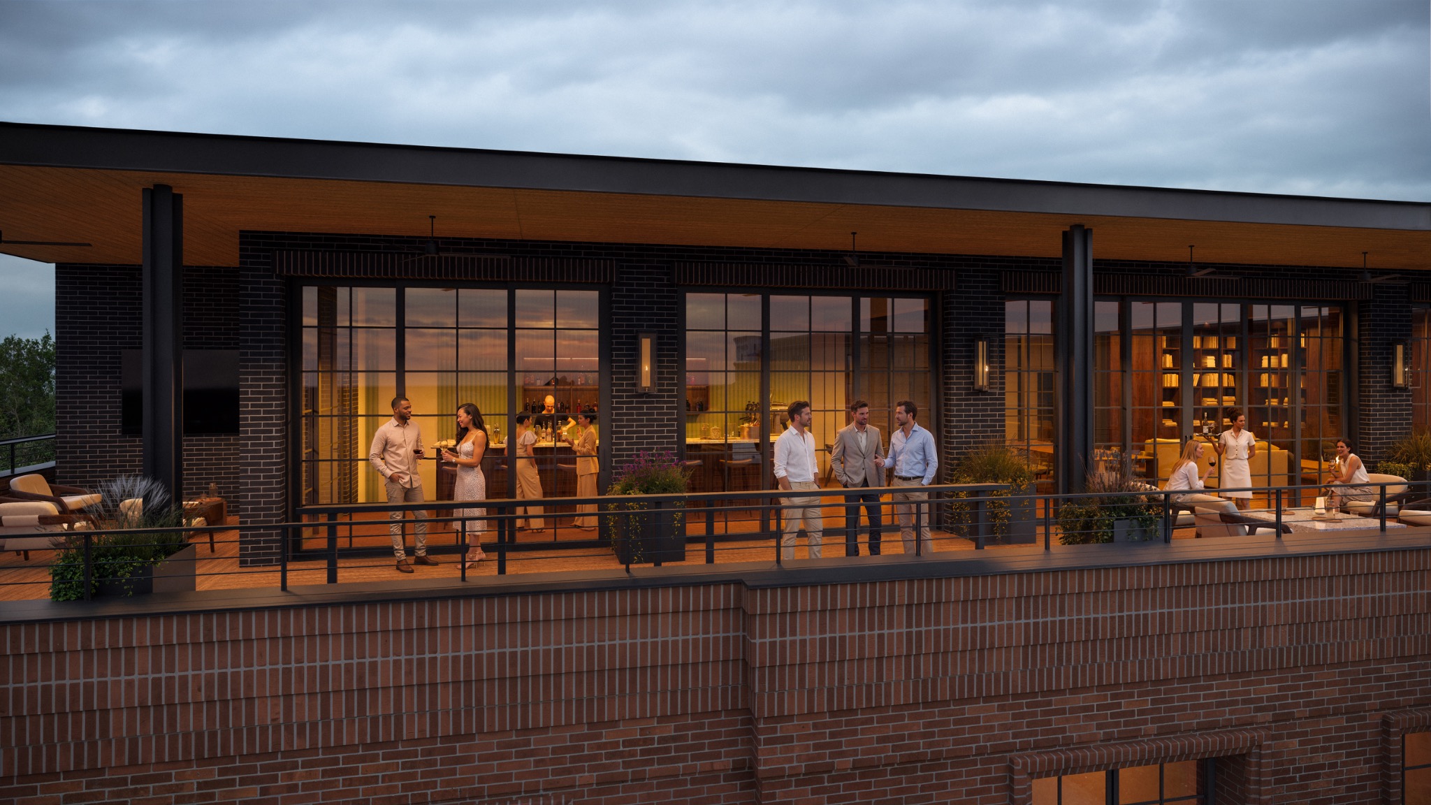 Residents gathering on The Everly rooftop terrace in the evening